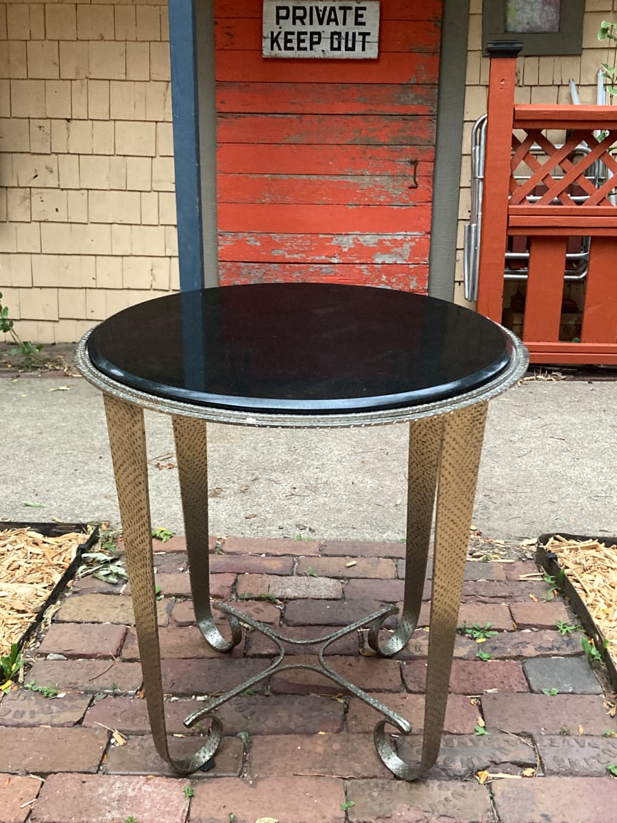 Round black marble topped table 