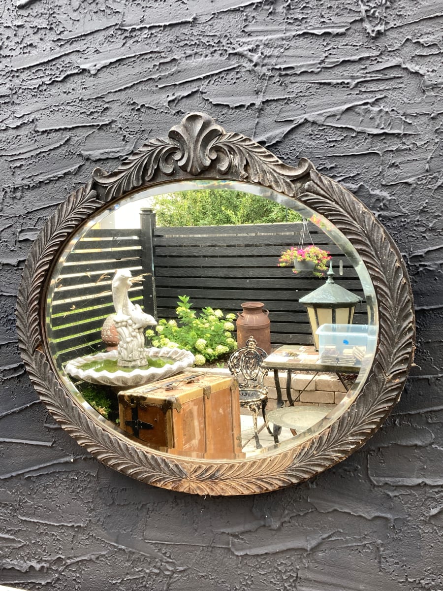 black painted oval mirror 