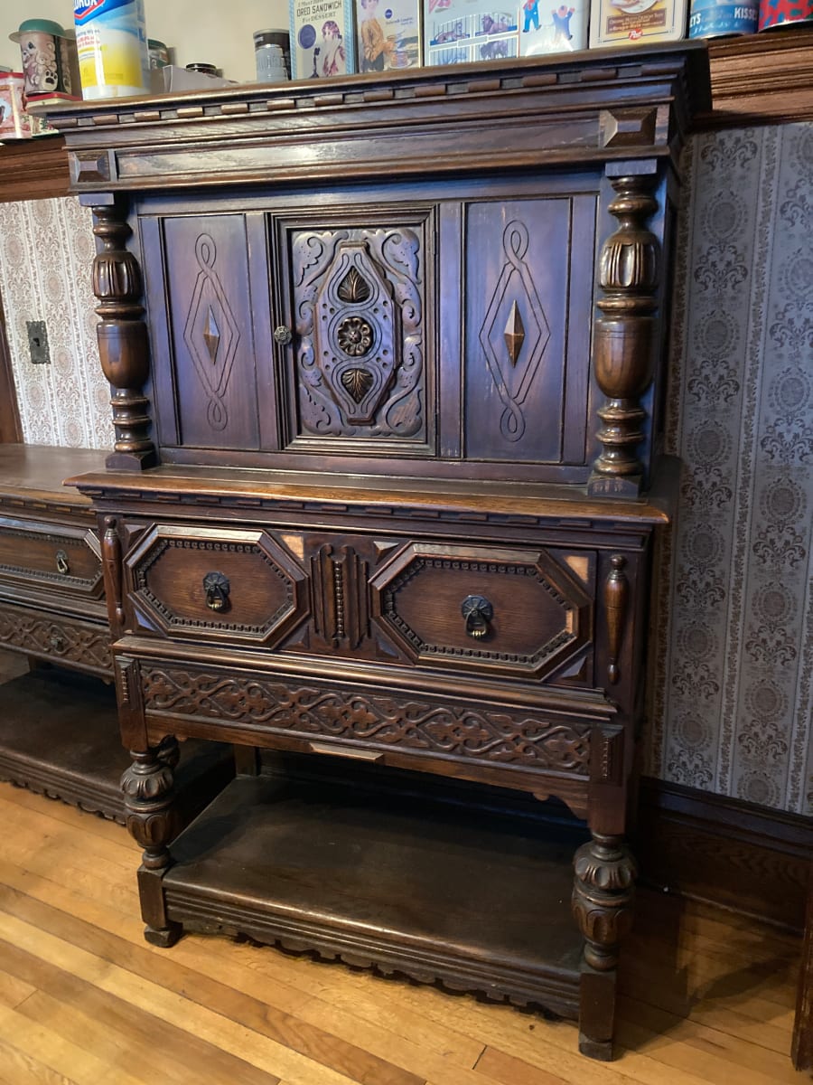 Carved oak linen press 