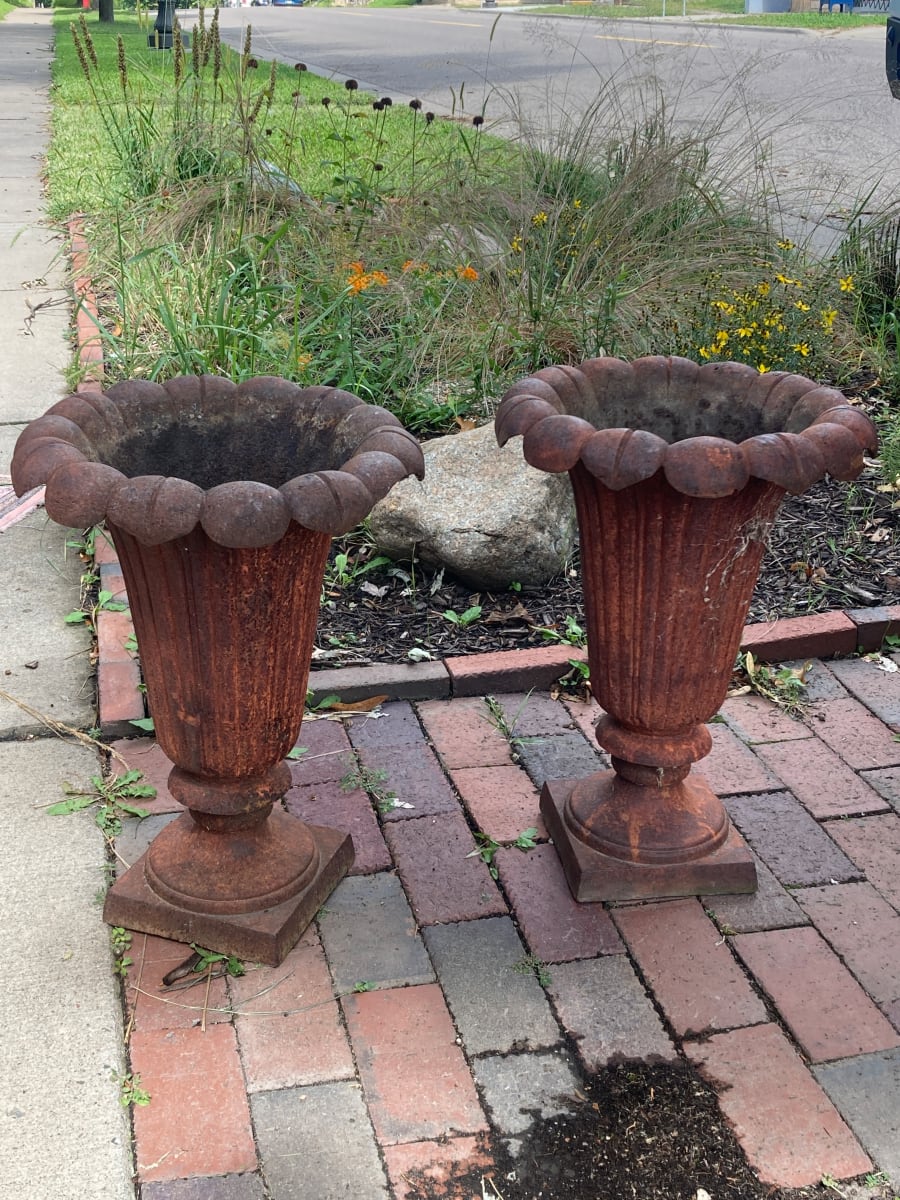 Pair of cast iron urns 