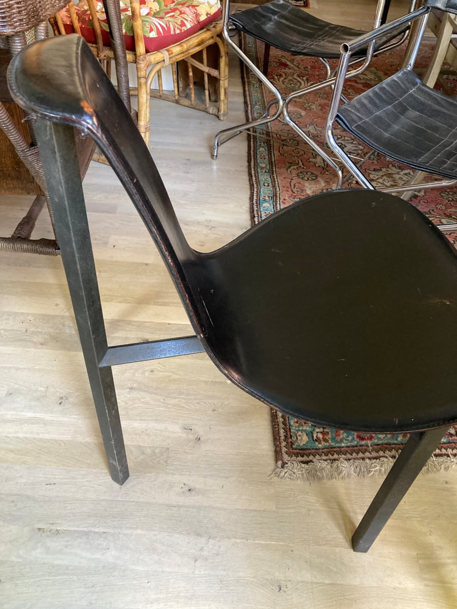 Pair of post modern black leather occasional chairs from the collection of TIMELINES ANTIQUES