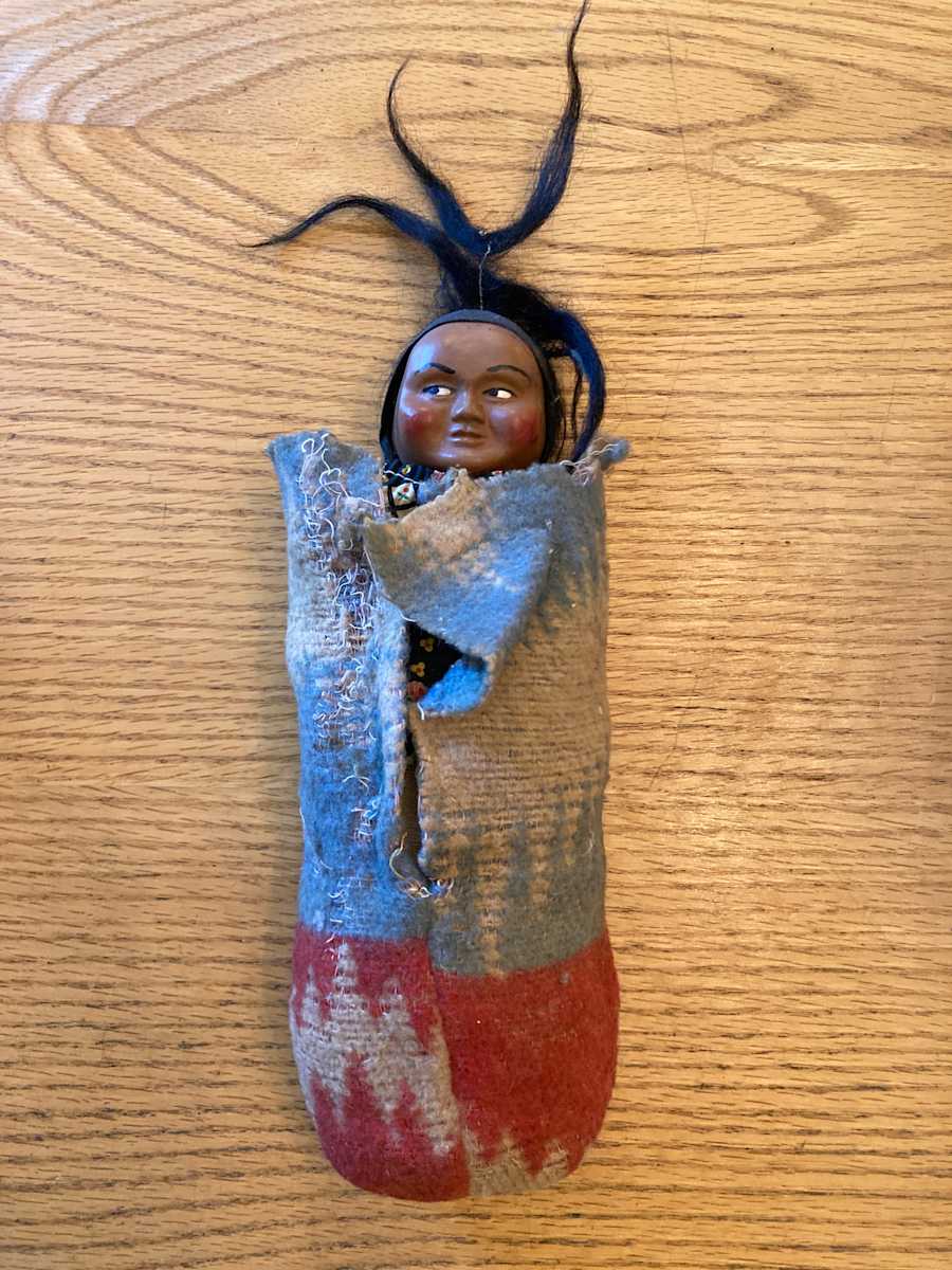 Skookum Indian doll in sleeping bag 