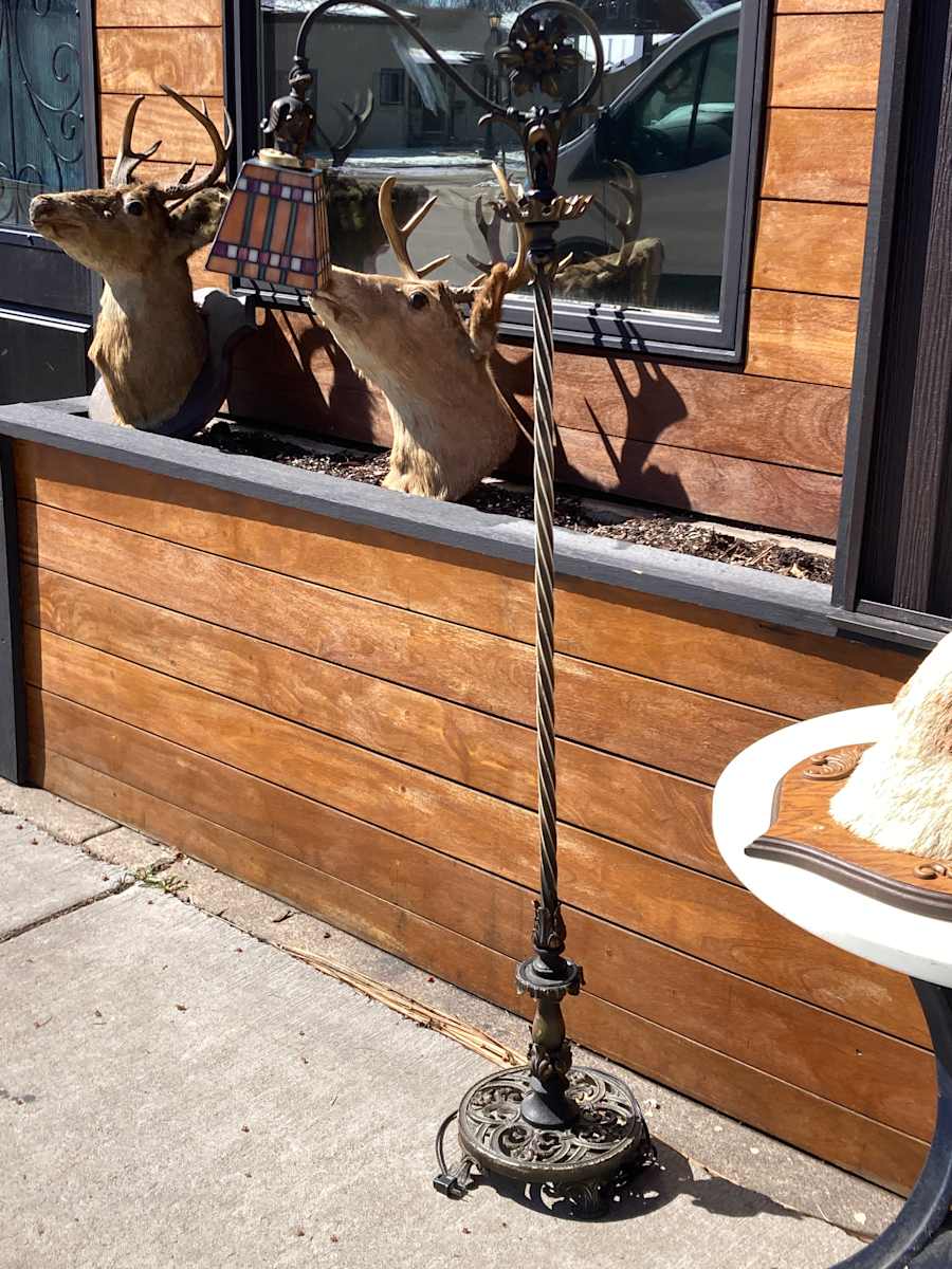 ornate floor lamp with colorful shade 