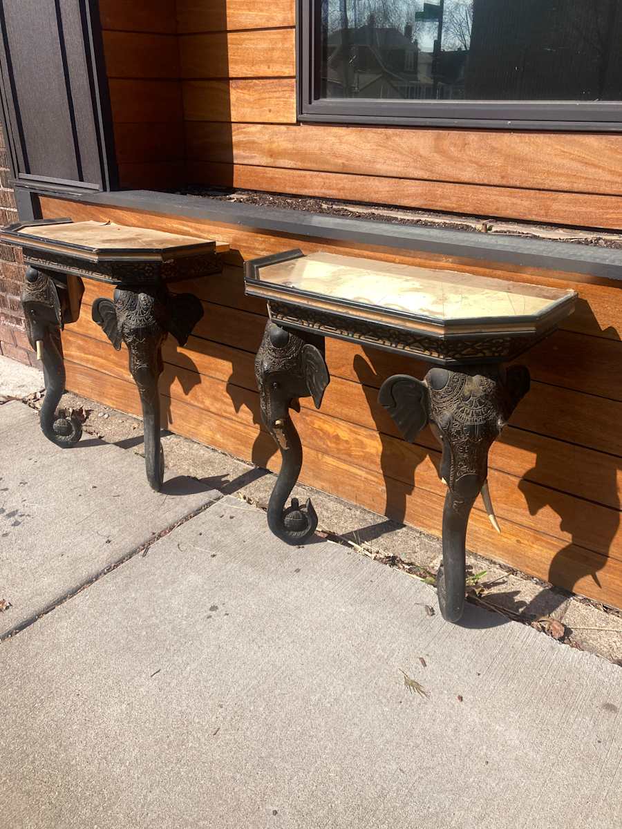 Pair of Elephant demilune tables 