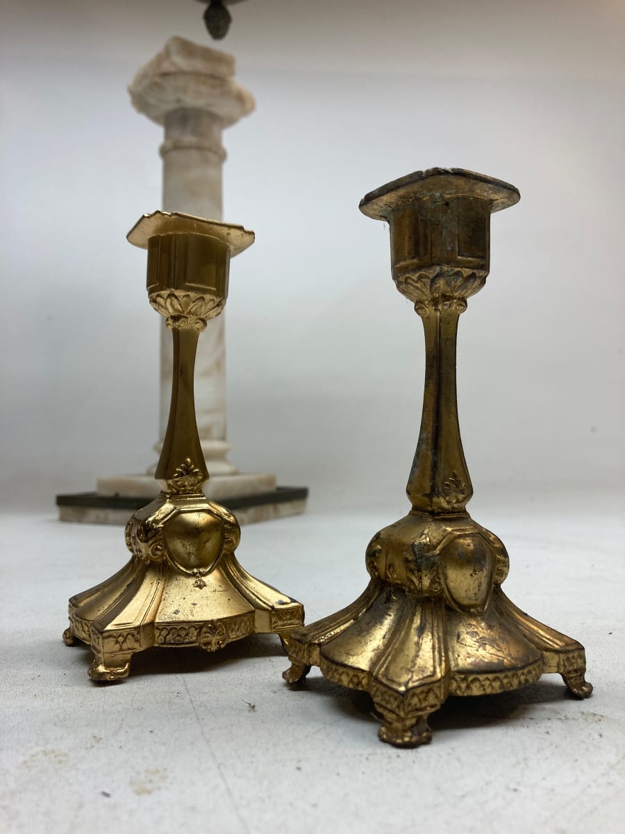 Pair of gold colored small candle sticks 