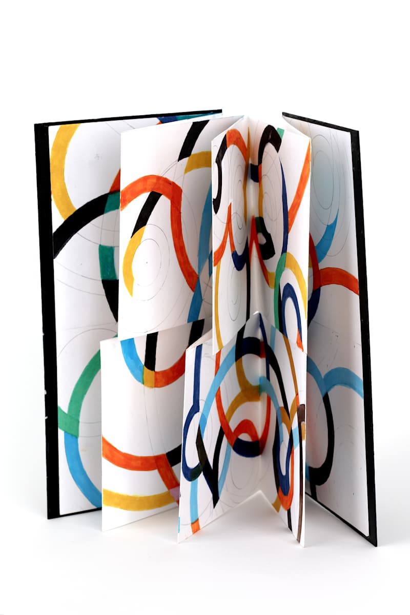 Maskerade 1 by Stefani Peter  Image: Cover: Black Core Archival Matboard - opened 10.5x 10 in.
