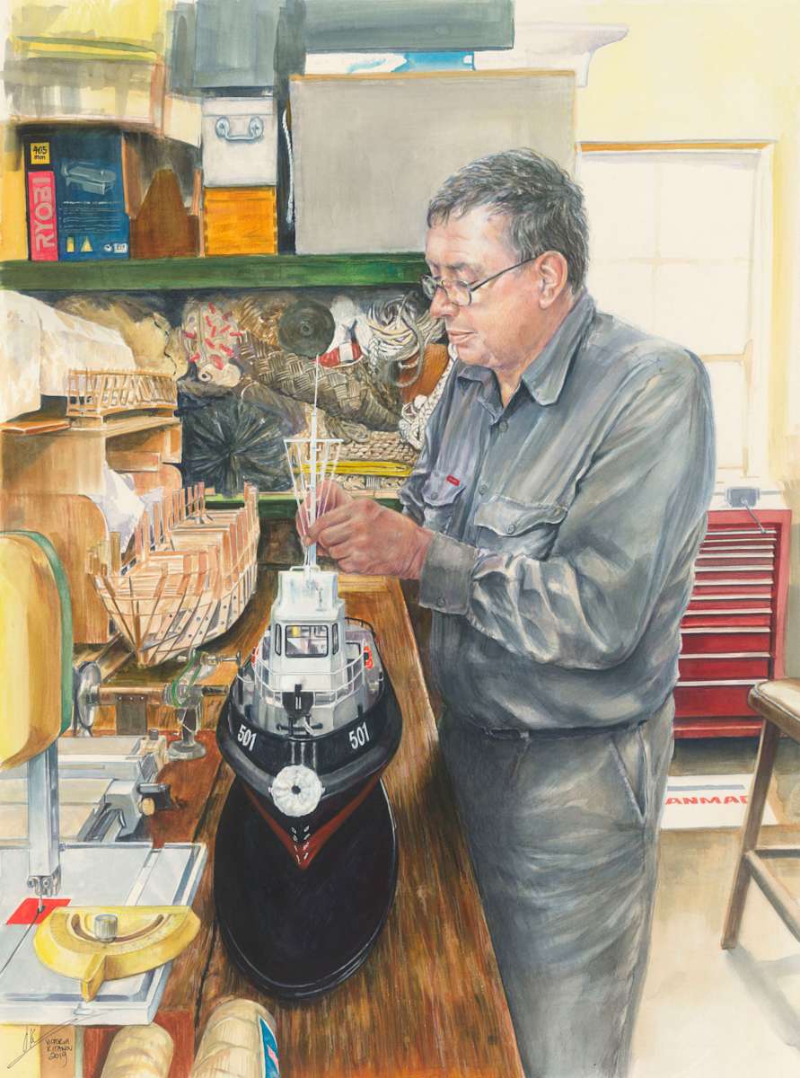 BRONZEWING: Portrait of David Glasson and model Harbour Tug Small (501), Royal Australian Navy by Victoria Kitanov  Image: Master model maker, David Glasson adding finishing touches to RAN HTS (501), 'BRONZEWING'