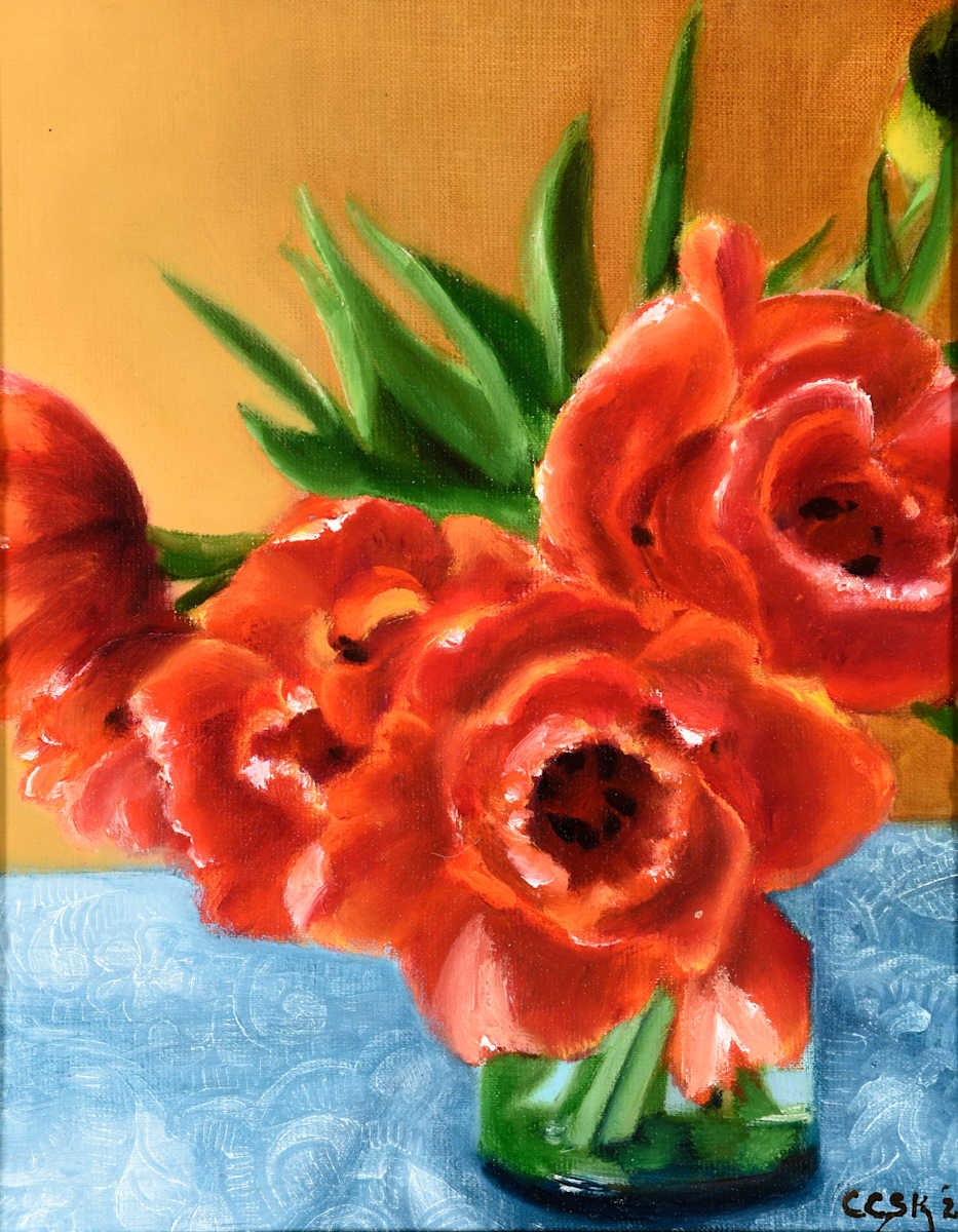 Orange and Red Flowers on a Lace Tablecloth by Carolyn Kleinberger 
