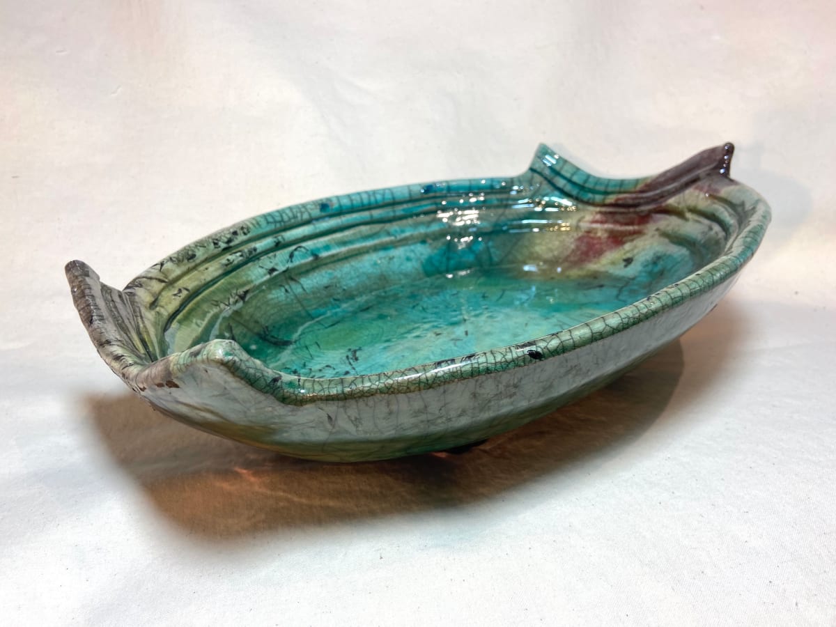 Selene by Mariana Sola  Image: Raku handbuild piece. WSO clay blue by you glaze
