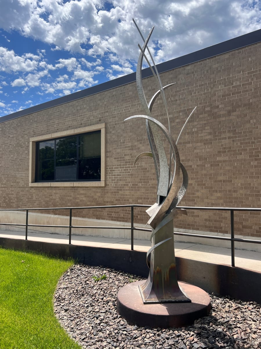 Tall Grass by Dale C. Lamphere  Image: Direct observation of nature has always been the guiding force in Lamphere’s work and often results in the biomimicry of structural patterns; from monumental landscapes to human forms to abstracts. In his monumental work there is a clear synergy of art, engineering, and sense of place. His work involves design, fabrication, and structural engineering disciplines.