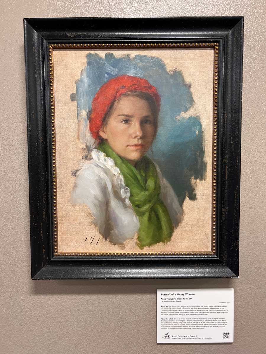 Portait of Young Woman by Anna Youngers  Image: “The subject, Regina Brunz, emigrated to the United States from Ukraine when she was a high school junior. This portrait was done when she was a college junior at the University of Sioux Falls. Much of my inspiration is derived from the classical imagery of the Old Masters. I aspire to create that timeless quality in my own paintings. I want my work to capture the simple transcendent beauty of what is experienced day to day.”