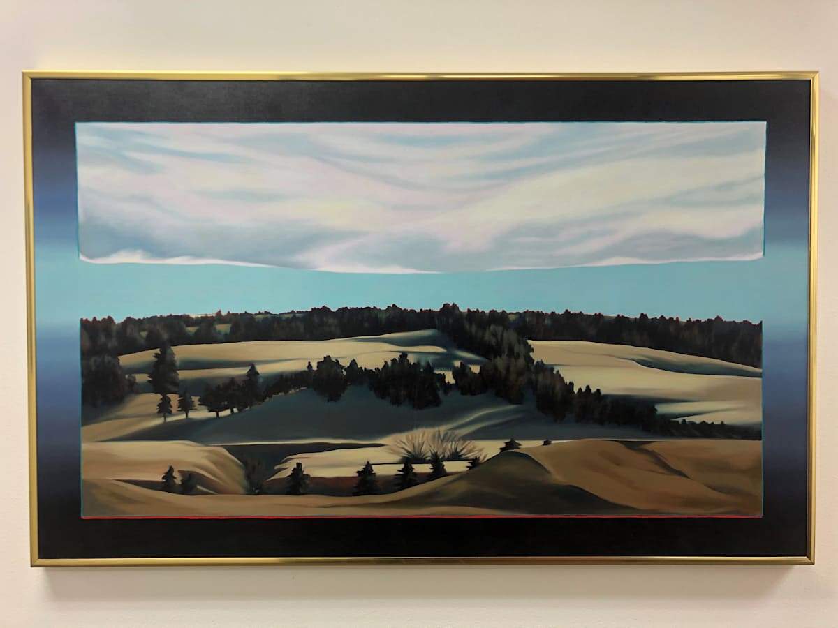 Evening's Edge by Lynn Thorpe  Image: “My intent by floating the planes of both sky and earth within a surround of graded blues is to create a contrast between a specific patch of earth and sky and the timeless infinity of space in which we float. I keep a set of severe limits to create some tension in finding ways to relate the earth and sky or what happens between them. Among these limits is the effort to strip away detail, paring down to the essential landforms and smoothing the flourishes of the brush to express the elemental silence the huge space of the plains evokes in me. The horizon is marked by a red line, but sometimes that line must occur elsewhere in the painting. I think of the red line as the life force.”