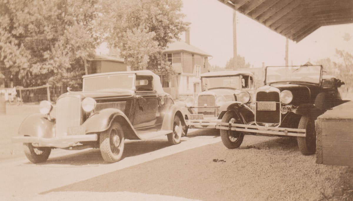 Cars at Grange League Federation Store by Maynard A. Knights 