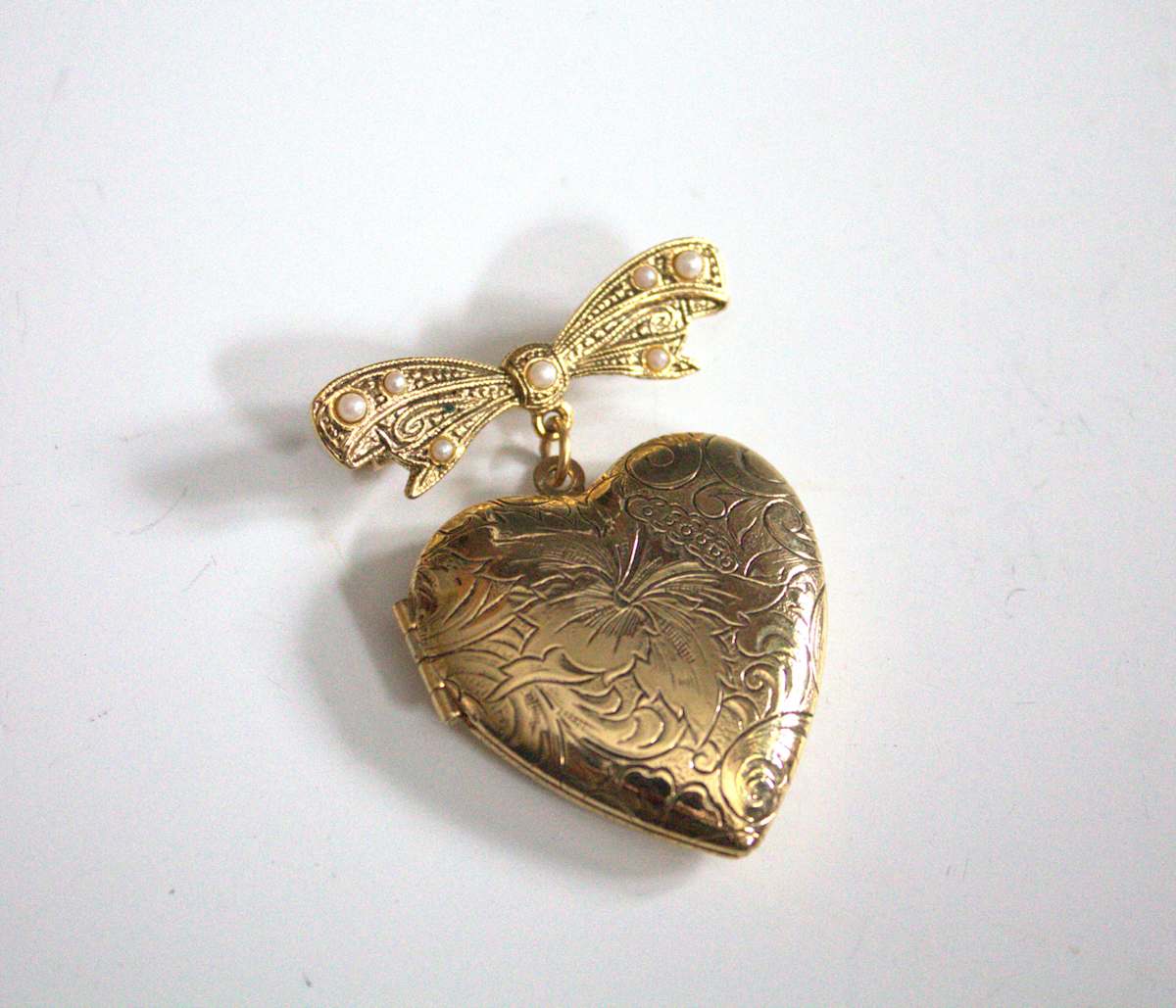 Locket Brooch by 1928, Image 1.