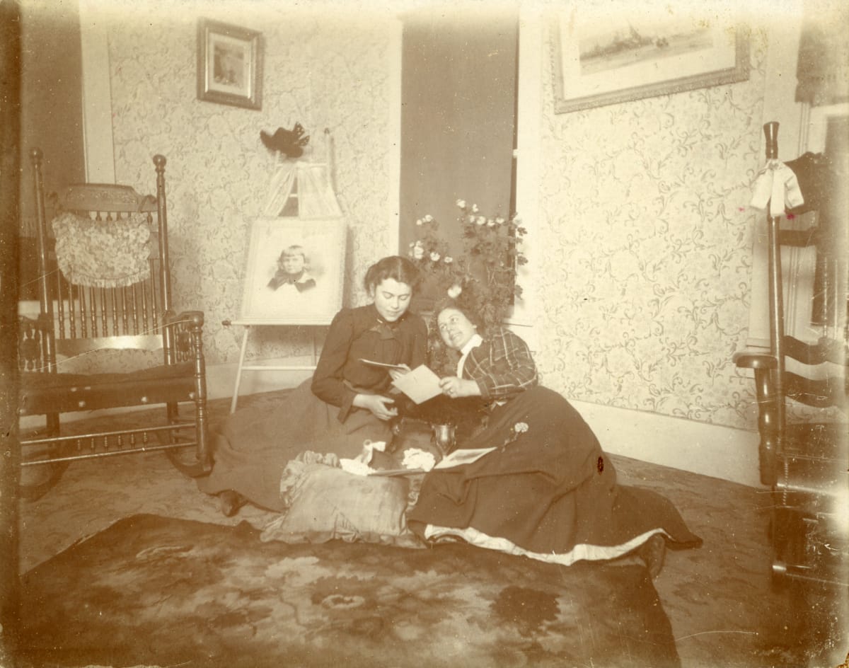 Perusing Photos in the Parlor by William H. Langdon, Image 1.