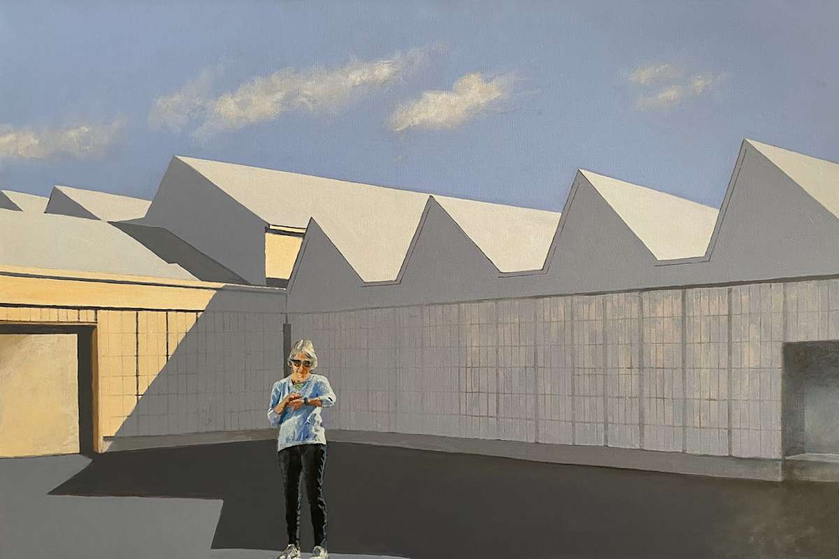 Industrial Wave Series: Time Check by Douglas H Caves Sr  Image: A woman checks her watch while standing in front an Industrial building.