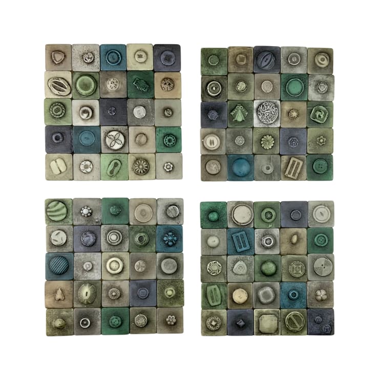 Button Cards by Susan Madacsi  Image: Button Cards:
I was prompted to create this piece when my mom gave me a Brobdingnagian jar of buttons. It celebrates a typically unappreciated functional and yet complicated object, the button. Size, shape, aesthetic, material and attachment to a garment all factor into how a button is designed and placed. Is the intent to be showy? Is it to simply be usable or relay a message of status or affection? People intentionally removed and kept these practical objects for generations. These buttons would prompt memories of family, or events, or places in which the garment was worn. They acted as seeds and heirlooms of the family storyteller and historian.