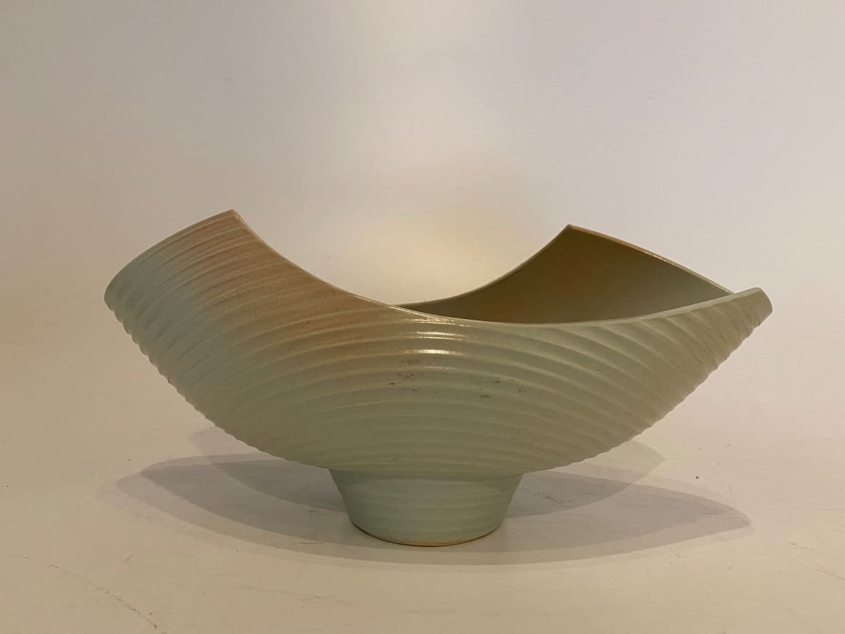 Asymmetrical ceramic ikebana vase on a footed base 