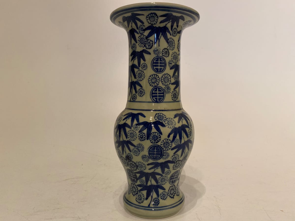 Ikebana vase with bamboo and flowers 