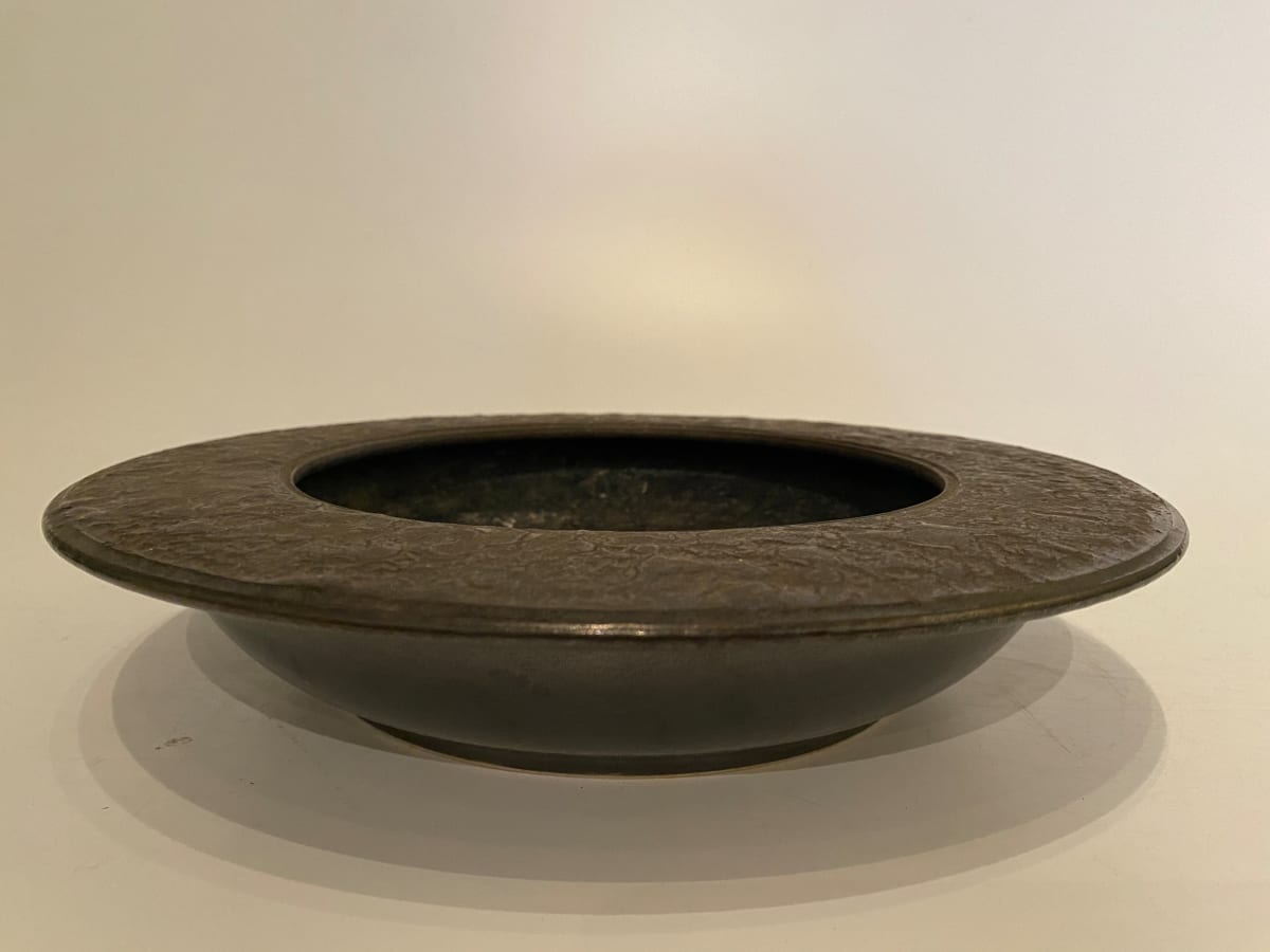 Flat, black ceramic ikebana vase 