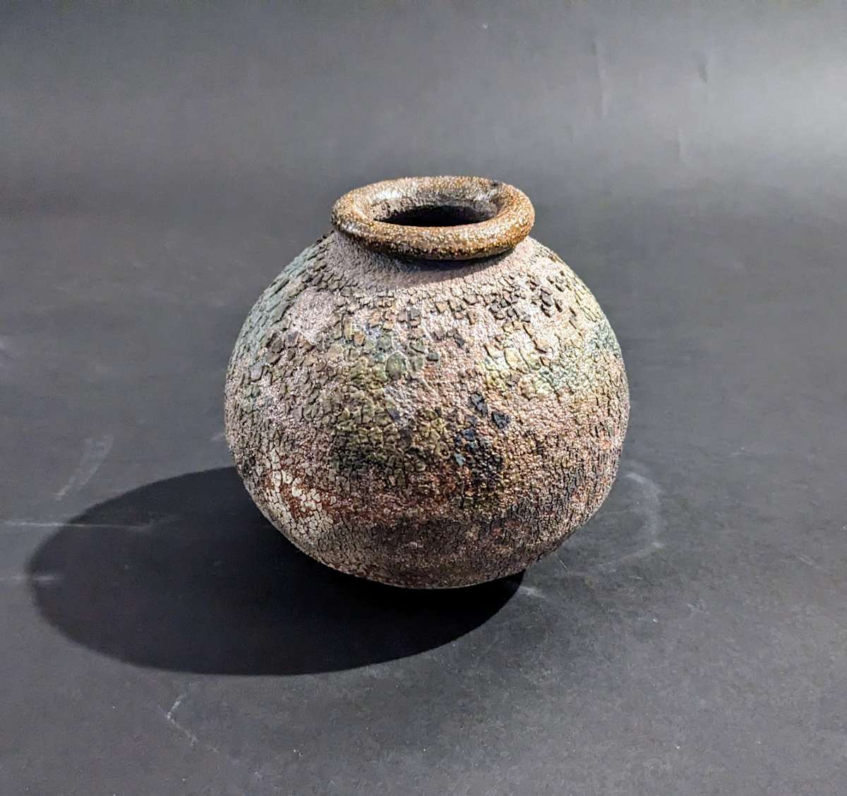 Small globular ceramic ikebana vase 