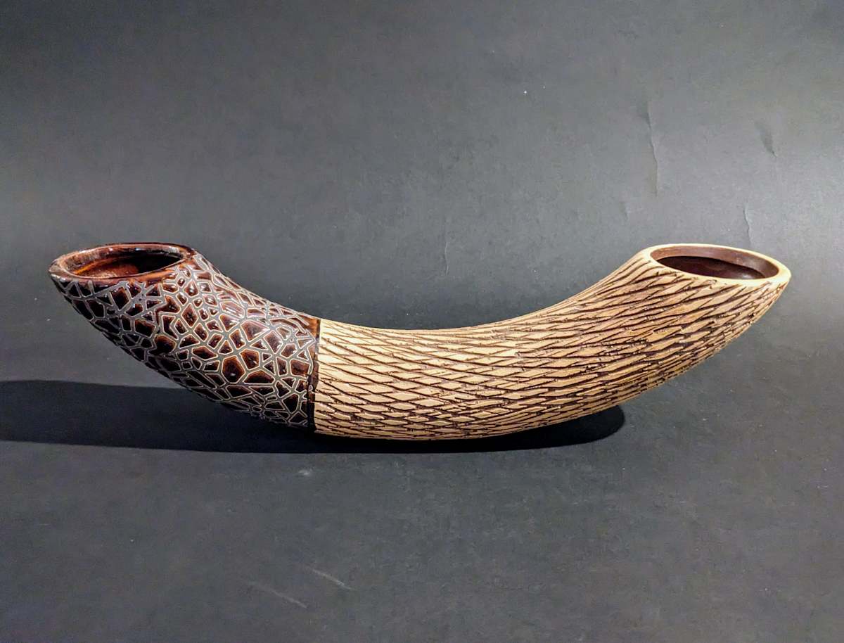 Curved ceramic ikebana vase 