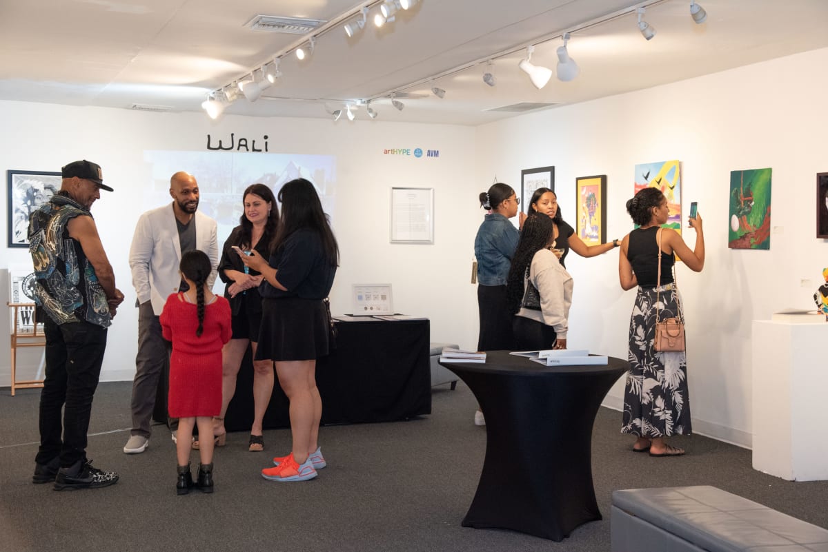 Guests enjoying Wali's original artwork