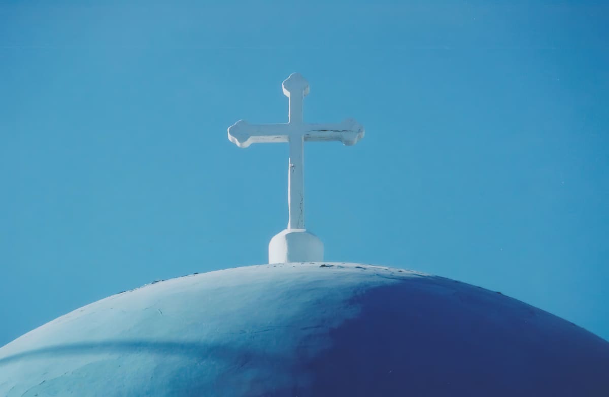 Blue sky with Cross - Santorini, Greece by Jenny Nordstrom  Image: Image by John D. Wanagas