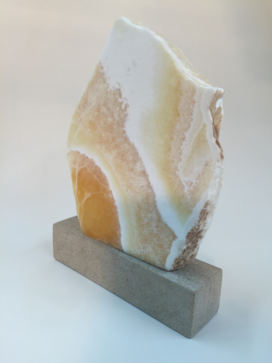 FLAME / HONEYCOMB CALCITE by Robin Antar  Image: Organic forms depicted in the “Expressions in Stone” series, like this piece, are expressions of Robin Antar’s life experiences. This piece is made of Honeycomb Calcite. Dimensions: 10”h X 8”w X 2”d. For questions regarding this item, please email info@rantar.com.