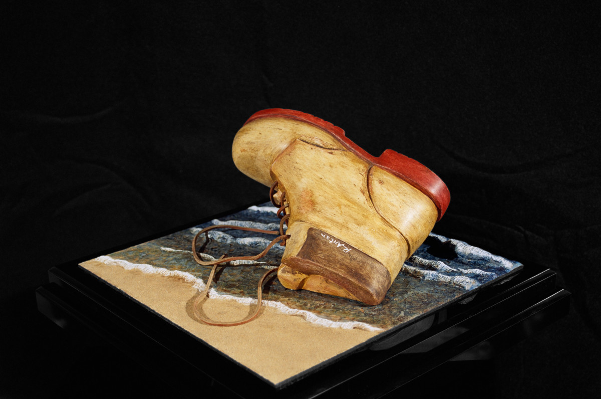 ISRAELI LIMESTONE SCULPTURE SHOWING A BOOT WASHED UP by Robin Antar 