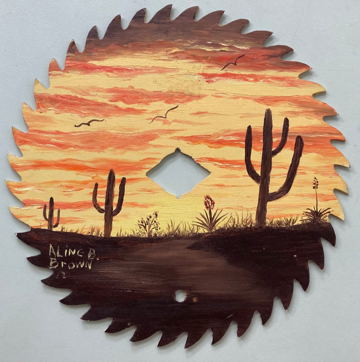 Sawblade painting by Aline Brown 