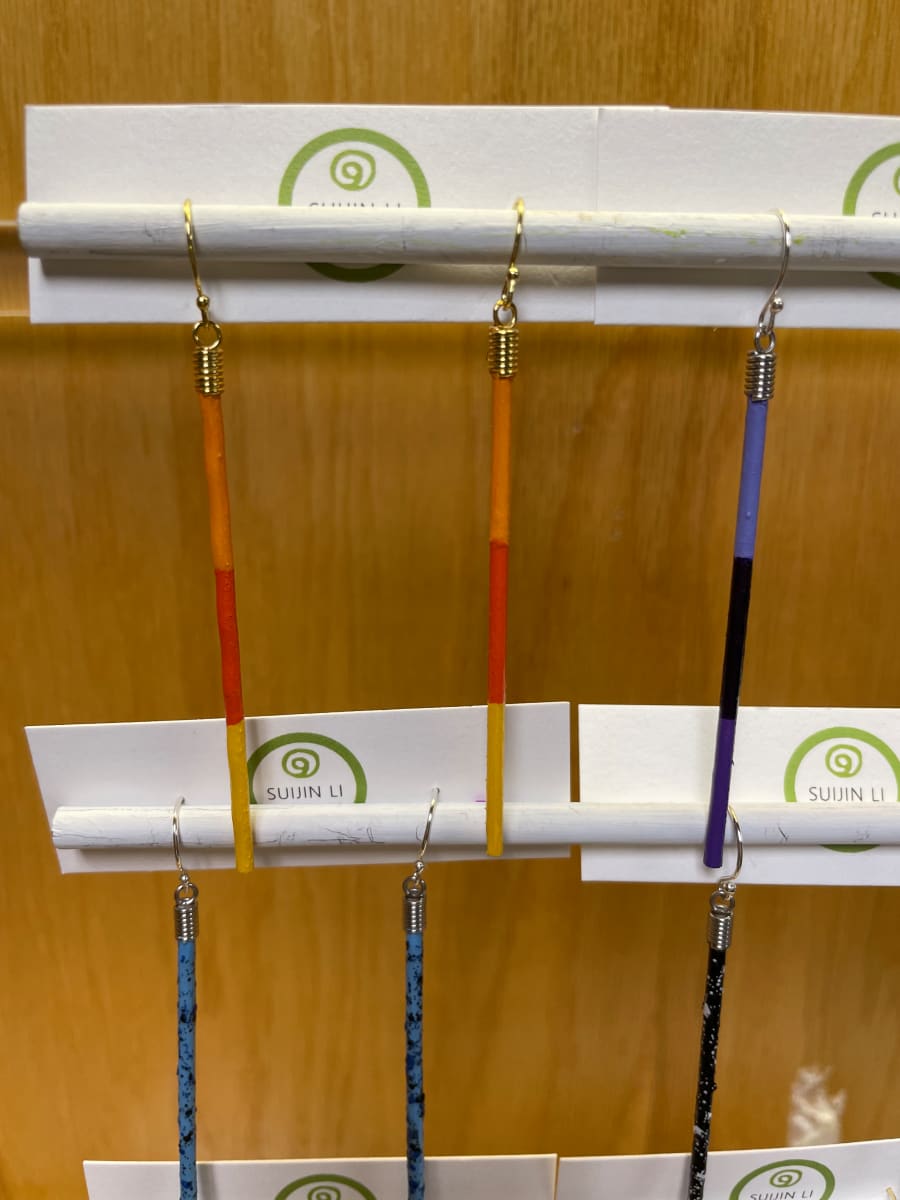 Orange stripes stick earrings by Suijin Li 