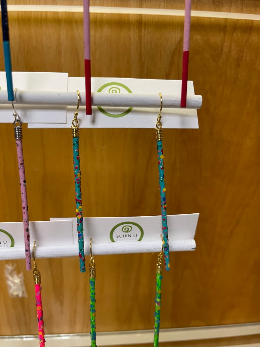 Turquoise speckled stick earrings by Suijin Li 