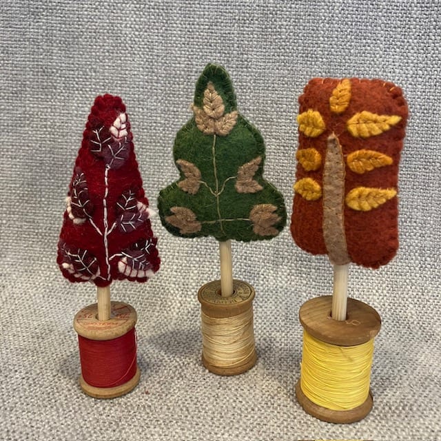 Wool Felt Trees - Red, Green and Rust by Christine Shively Benjamin  Image: Three Wool felt trees on wooden thread spools