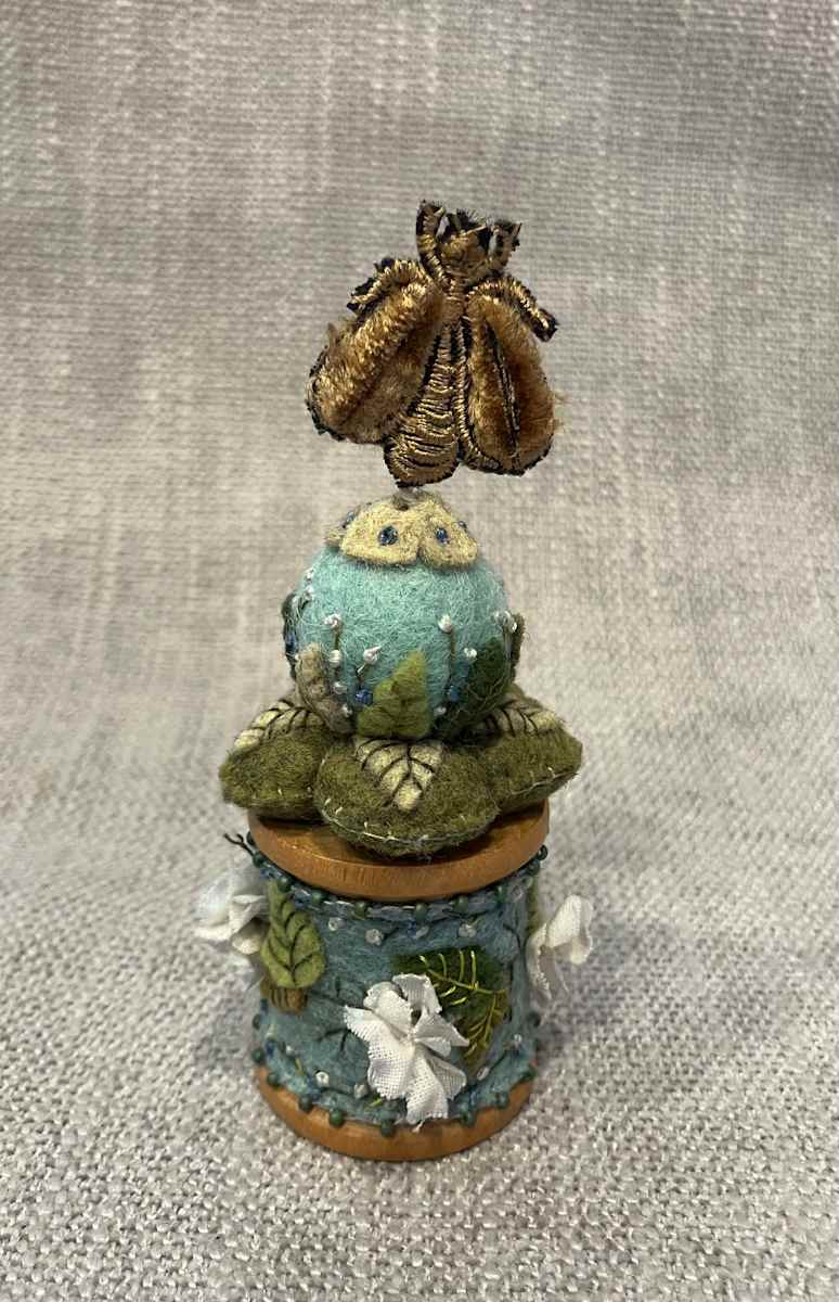 Blue felt vintage spool by Christine Shively Benjamin  Image: Full front view