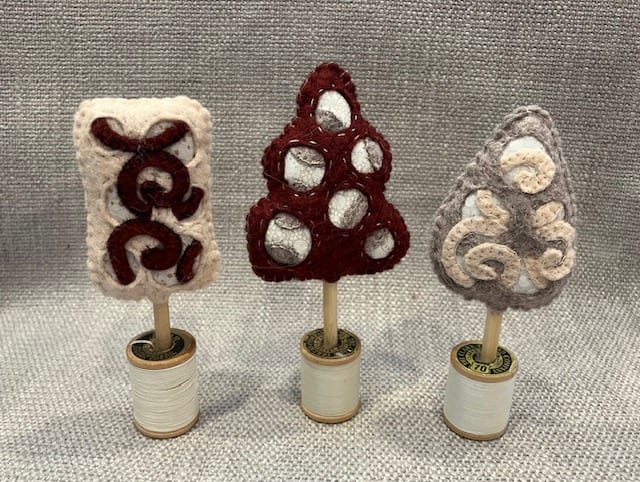 Wool Felt Trees by Christine Shively Benjamin  Image: Three wool blended felt trees with cutwork design