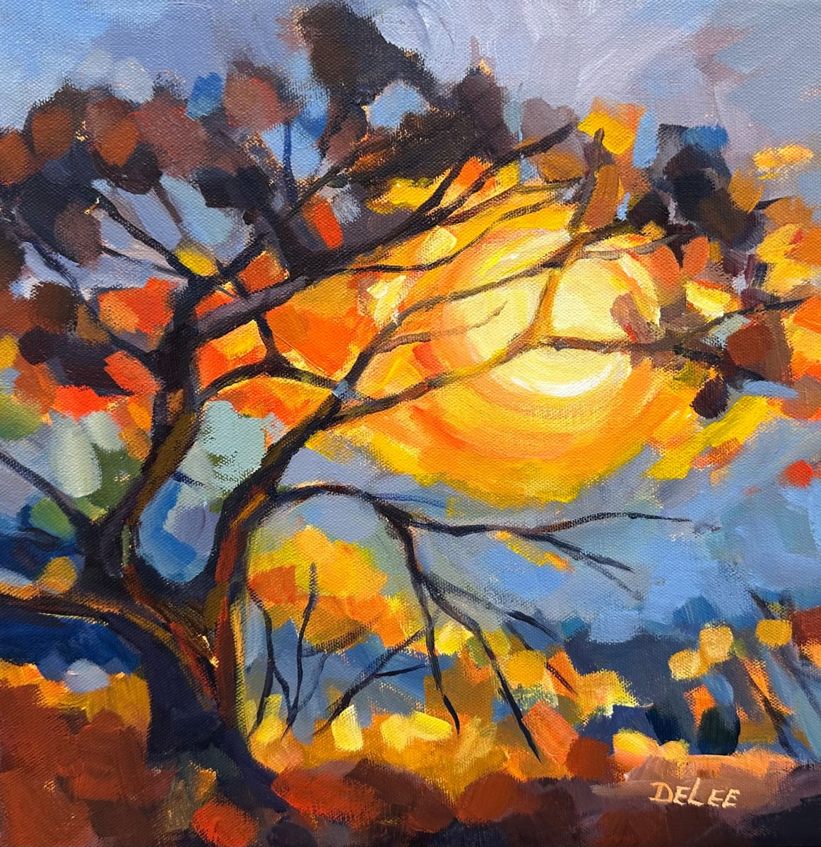 THE SUN SUSPENDED by DeLee Grant  Image: “THE SUN SUSPENDED”
The sun suspended in the centre 
of an evening tree.
Branches haloing dark and still 
against the moment’s volcanic centre.
