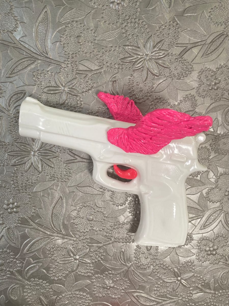 Pink Fantasy One by annekwasner@gmail.com  Image: White porcelain gun with bright pink wings and trigger. 