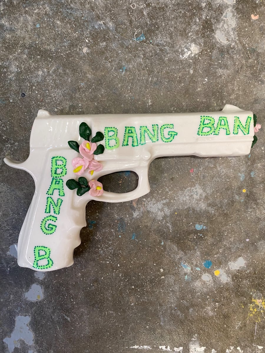 Bang Ban by annekwasner@gmail.com  Image: A porcelain slip gun, with text in ceramic marker and embellishments in craft clay. 
