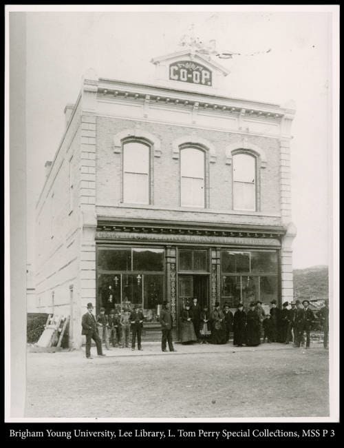 [People Standing Outside Store] by George Beard  Image: Co-op people standing outside store.