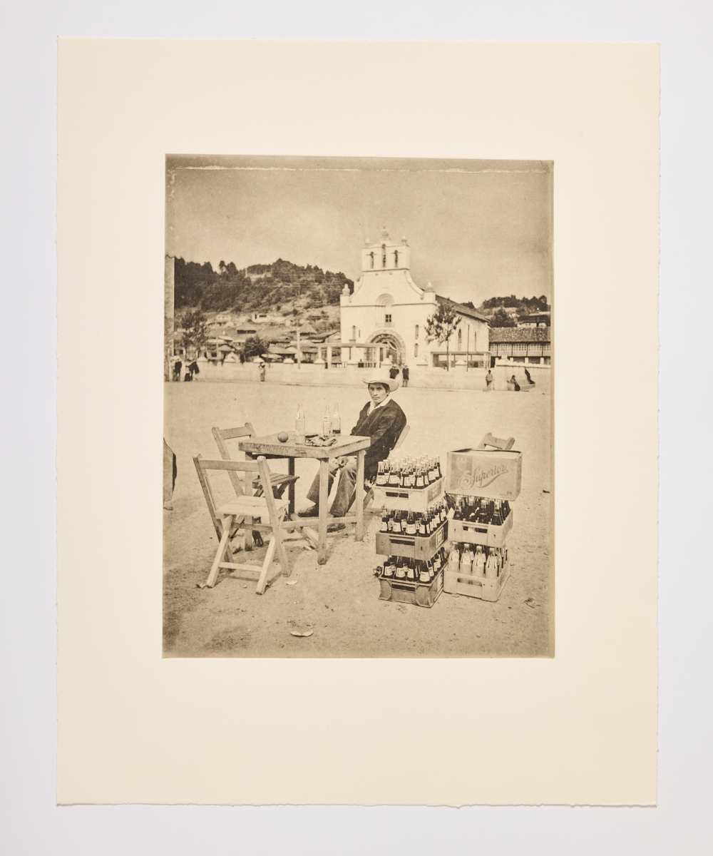 Marcos Xilón Gómez, A man is in the plaza having a drink by Wendy Ewald 
