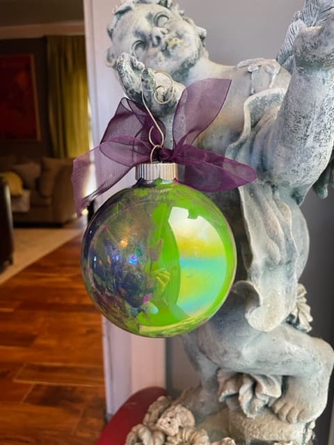 Celebration Collection #18  Image: gorgeous lime green, deep purple, pops of bright pink and glitter create a magical experience on this iridescent glass globe...the colors are hard to photograph