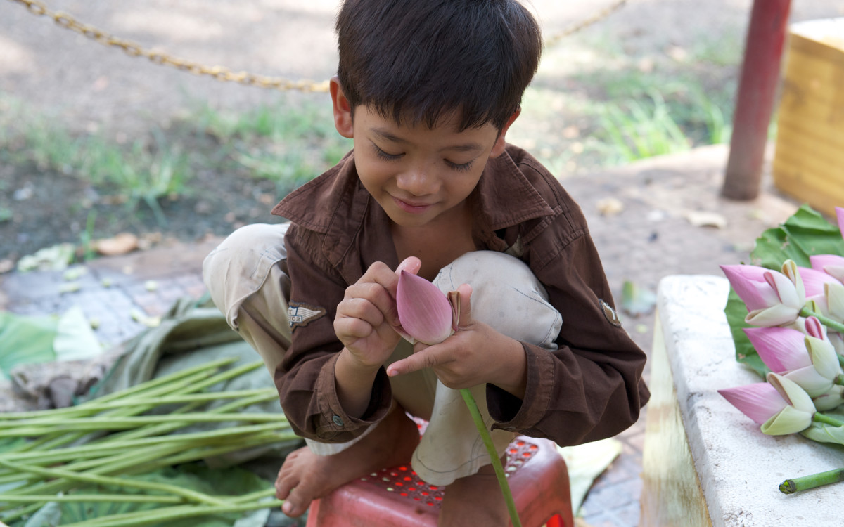 Boy with Flowers, Siem Reap, Cambodia by Bart Marcy 