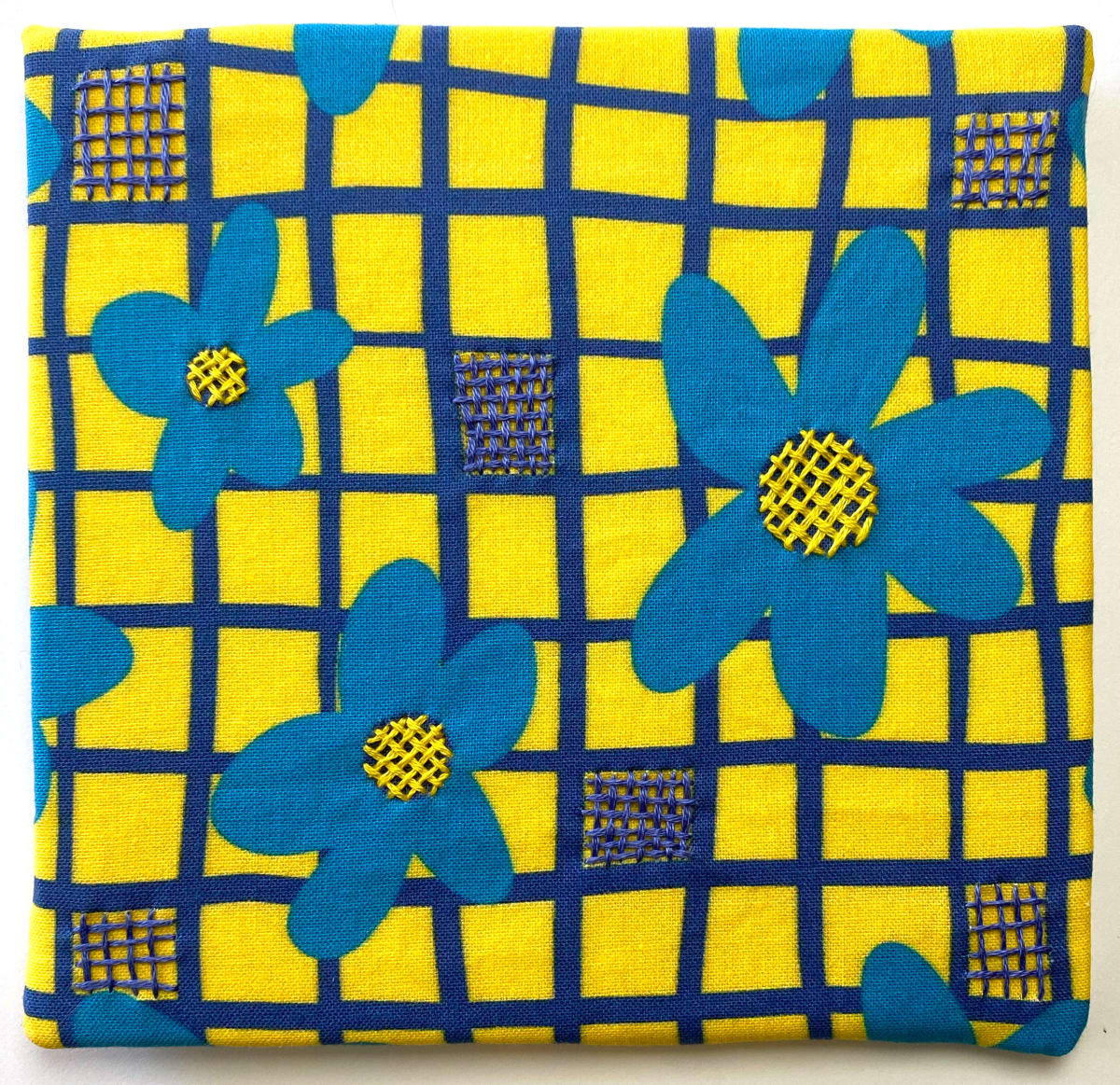 Flower Power - Blue on Yellow by Anne M Bray  Image: Embroidery on a print that I designed.