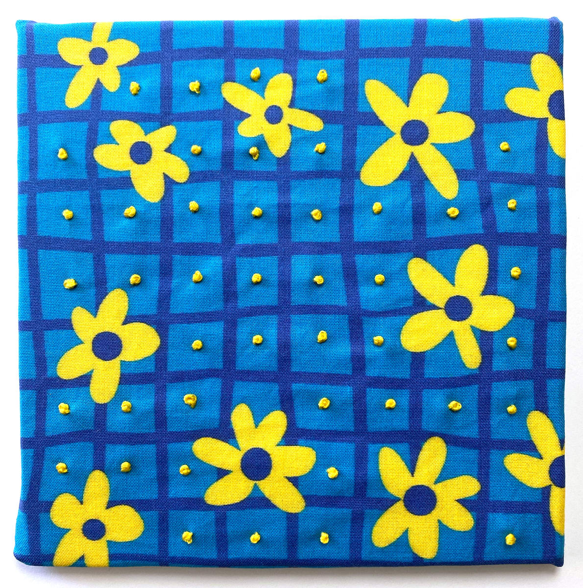 Flower Power - French Knots by Anne M Bray  Image: Embroidery on a print that I designed.
