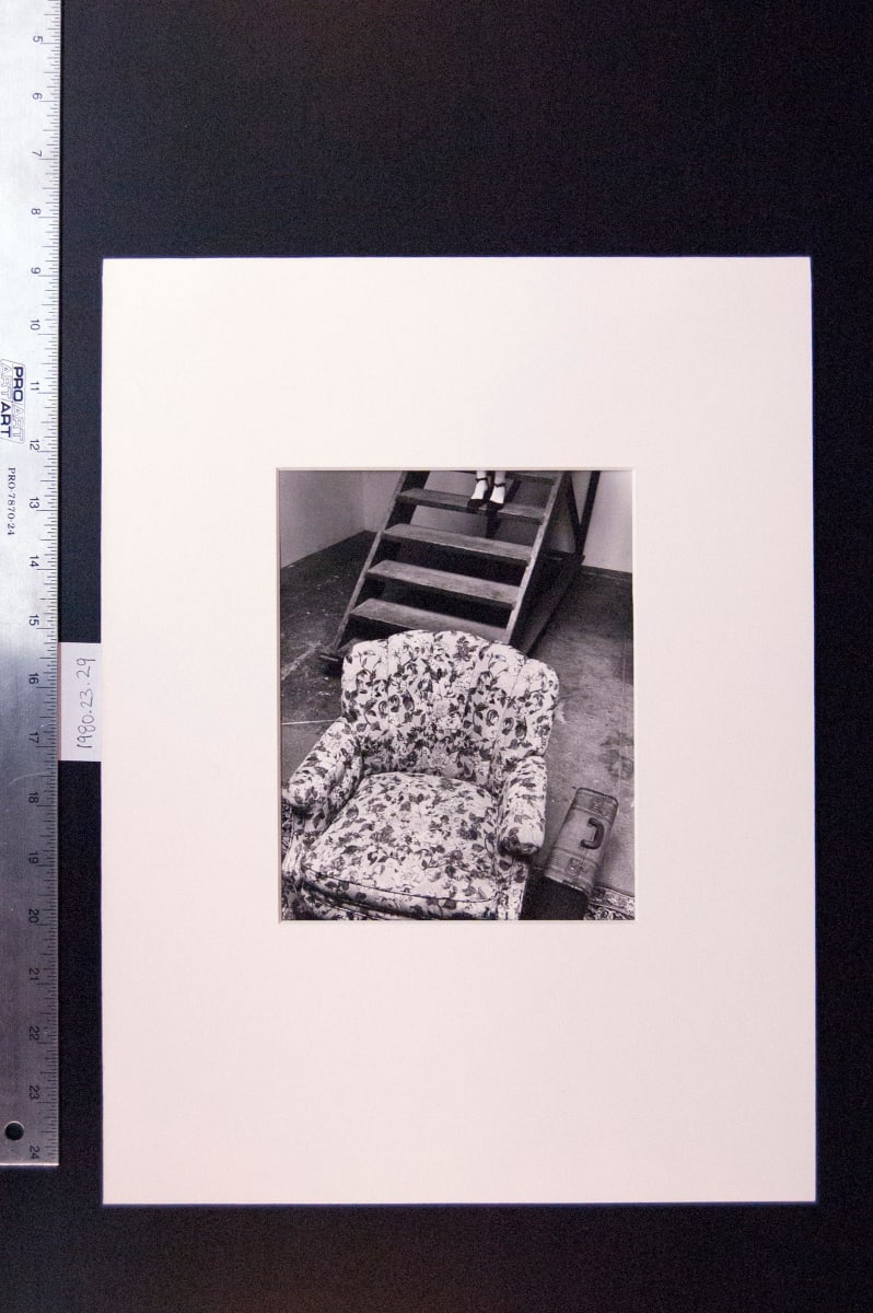 Untitled 1972 (Armchair, suitcase, stairs, feet) by Leland Rice 