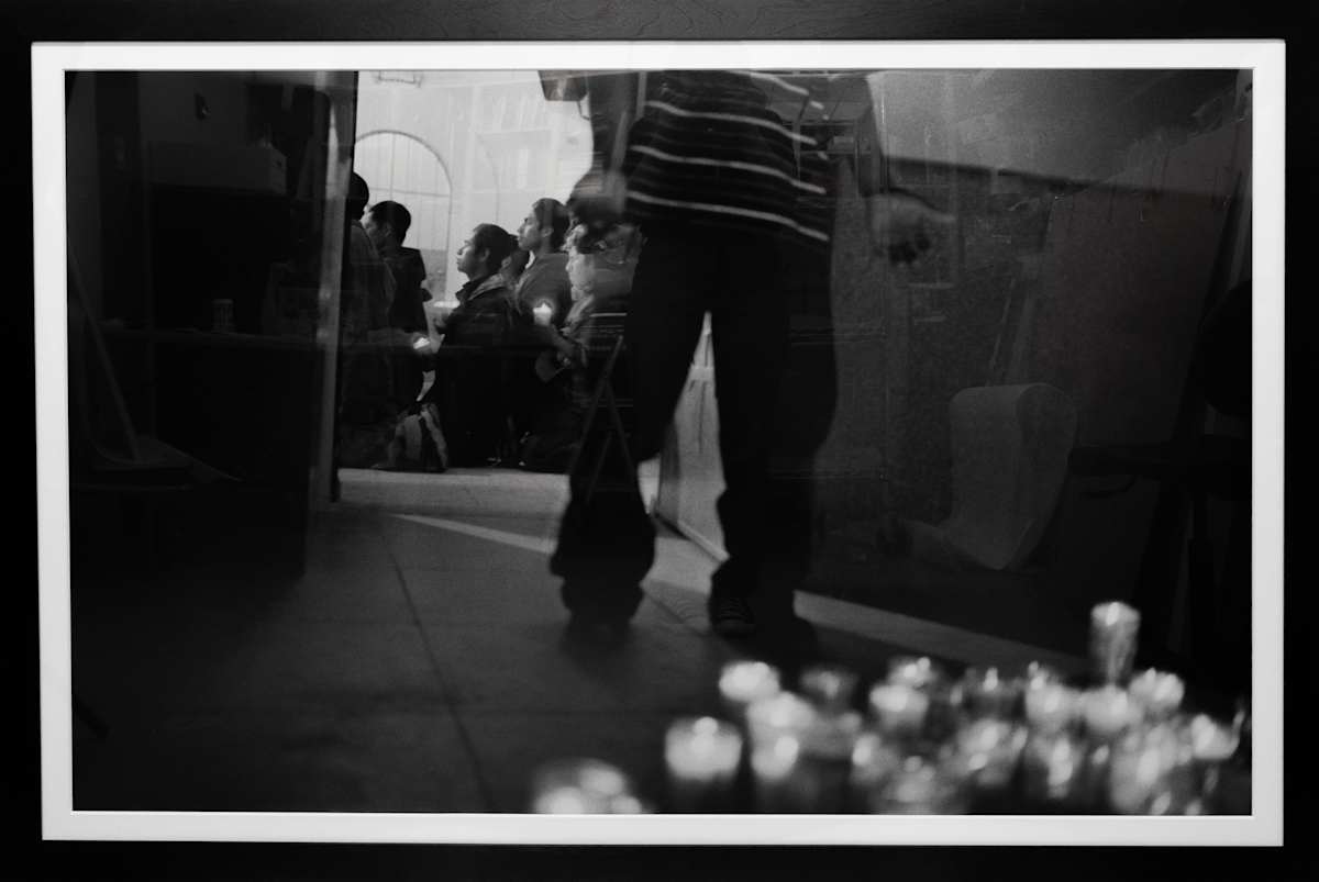 Young men and boys from southern Mêxico light votive candles and pray for a safe crossing before leaving the Sonoran town of Altar by Julián Cardona 
