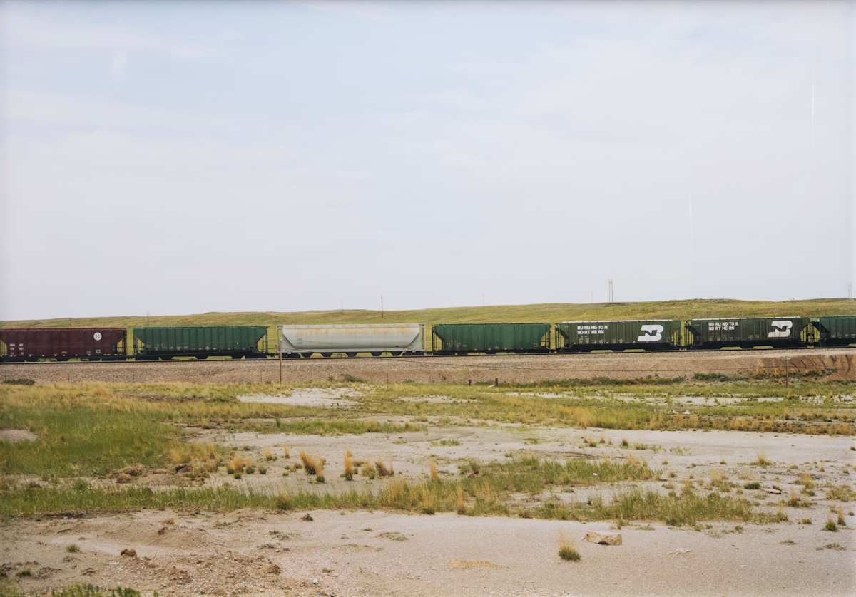 Untitled (Red, green, silver train cars, Upton, Wyoming) by Victoria Sambunaris 