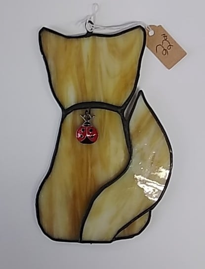 brown cat with ladybug gem by Craig Wills 