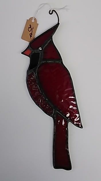 red cardinal bird with red swirls on stomach by Craig Wills 